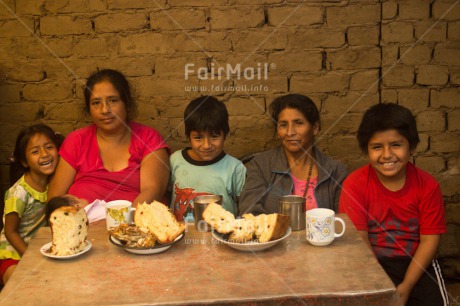 Fair Trade Photo 40-45 years, 50-55 years, 5 -10 years, Activity, Child, Children, Colour image, Day, Eating, Emotions, Evening, Family, Food and alimentation, Group, Happiness, Home, Horizontal, House, Indoor, Juan gabriel, Latin, Mother, People, Peru, Rural, Sitting, South America