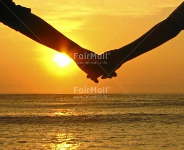 Fair Trade Photo Colour image, Evening, Hand, Horizontal, Love, Marriage, Outdoor, Peru, Sea, Seasons, South America, Summer, Sun, Sunset, Together, Valentines day, Water