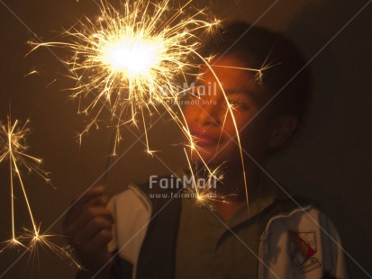 Fair Trade Photo Christmas, Colour image, Congratulations, Firework, Horizontal, Indoor, New Year, Night, One boy, Party, People, Peru, Portrait halfbody, South America