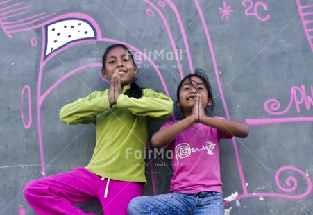 Fair Trade Photo 10-15 years, Activity, Casual clothing, Clothing, Colour image, Day, Green, Horizontal, Latin, Looking at camera, Outdoor, People, Peru, Pink, Smiling, South America, Two girls, Yoga