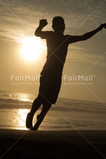 Fair Trade Photo Activity, Beach, Clouds, Emotions, Evening, Friendship, Happiness, Jumping, Light, One boy, Outdoor, People, Peru, Silhouette, Sky, South America, Vertical