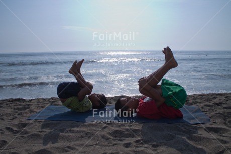 Fair Trade Photo 10-15 years, Activity, Backlit, Beach, Casual clothing, Clothing, Colour image, Evening, Friendship, Horizontal, Latin, Outdoor, People, Peru, Sand, Sea, South America, Together, Two boys, Water, Yoga