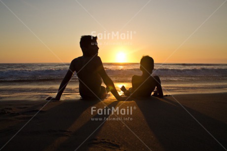 Fair Trade Photo Activity, Beach, Brother, Colour image, Colourful, Emotions, Evening, Friend, Friendship, Happiness, Horizontal, Light, Looking, Looking away, Outdoor, People, Peru, Relax, Relaxing, Sea, Shooting style, Silhouette, Sitting, Sky, South America, Sun, Sunset