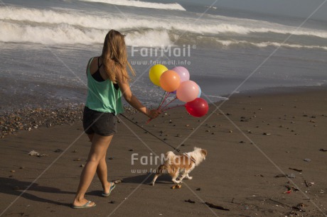 Fair Trade Photo Activity, Animals, Balloon, Beach, Birthday, Colour image, Dog, Horizontal, One girl, Party, People, Peru, Sea, South America, Summer, Walking