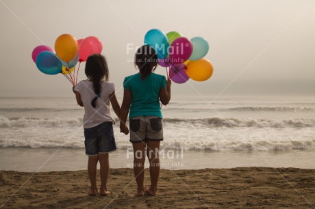 Fair Trade Photo Activity, Balloon, Beach, Birthday, Celebrating, Child, Colour image, Day, Emotions, Friendship, Girl, Happiness, Holding, Holding hands, Holiday, Horizontal, Multi-coloured, Ocean, Outdoor, People, Peru, Sand, Sea, Seasons, Sister, South America, Standing, Summer, Water