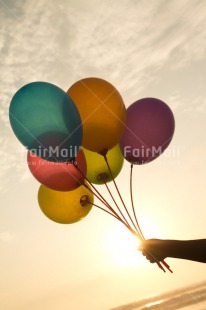 Fair Trade Photo Activity, Balloon, Beach, Birthday, Celebrating, Colour image, Day, Evening, Gift, Holding, Multi-coloured, Ocean, Outdoor, Peru, Sea, South America, Sunset, Vertical, Water