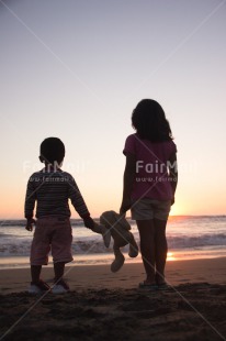 Fair Trade Photo Activity, Animals, Beach, Brother, Colour image, Colourful, Evening, Family, Friend, Friendship, Hand, Holding, Holding hands, Light, Looking, Looking away, People, Peru, Puppy, Sea, Shooting style, Silhouette, Sister, Sky, South America, Standing, Sun, Sunset, Two, Two people, Two persons, Vertical
