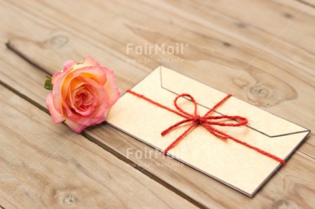 Fair Trade Photo Colour image, Envelope, Flower, Horizontal, Indoor, Invitation, Letter, Love, Marriage, Message, Peru, Red, Ribbon, Rose, South America, Table, Wedding, Wood