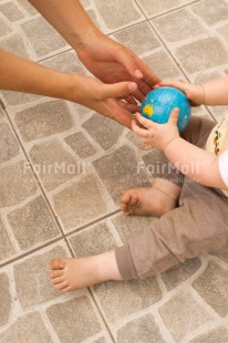 Fair Trade Photo 0-5 years, Activity, Baby, Caucasian, Colour image, Gift, Globe, Hands, Holding, Holiday, People, Peru, Sitting, South America, Travel, Travelling, Vertical, World