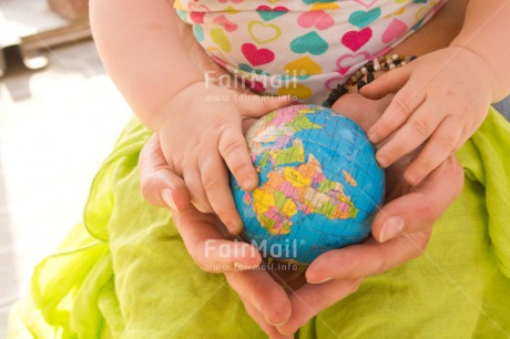 Fair Trade Photo 0-5 years, Activity, Baby, Caucasian, Colour image, Gift, Globe, Hands, Holding, Holiday, Horizontal, Mother, People, Peru, Sitting, South America, Travel, Travelling, World
