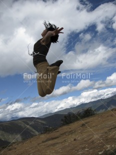 Fair Trade Photo 15-20 years, Activity, Clouds, Colour image, Day, Emotions, Freedom, Happiness, Jumping, Latin, Mountain, Nature, One girl, Outdoor, Party, People, Peru, Rural, Scenic, Sky, South America, Travel, Vertical, Well done