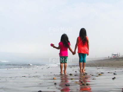 Fair Trade Photo 10-15 years, 5 -10 years, Activity, Beach, Children, Colour image, Flowers, Friendship, Girls, Holding, Holding hands, Horizontal, Latin, People, Peru, Sea, Sister, Sorry, South America, Thank you, Walking, Water
