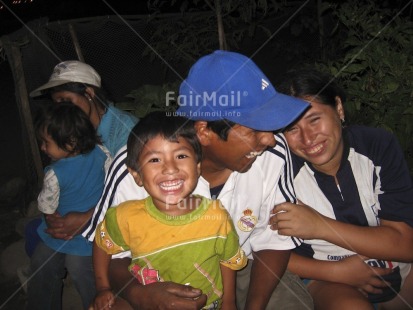 Fair Trade Photo Casual clothing, Clothing, Colour image, Emotions, Family, Fun, Group of People, Happiness, Horizontal, Latin, Love, Night, One boy, Outdoor, People, Peru, Smile, Smiling, South America, Streetlife