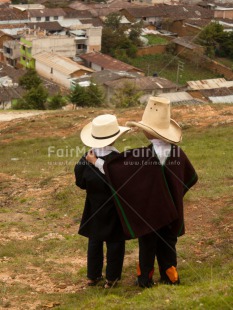 Fair Trade Photo 5 -10 years, Activity, Clothing, Colour image, Ethnic-folklore, Friendship, Grass, House, Latin, Looking away, People, Peru, Portrait fullbody, Rural, Scenic, South America, Together, Traditional clothing, Travel, Two boys, Vertical