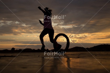 Fair Trade Photo 5 -10 years, Activity, Child, Clouds, Colour image, Evening, Horizontal, Peru, Playing, Shooting style, Silhouette, Sky, South America, Sunset, Wheel