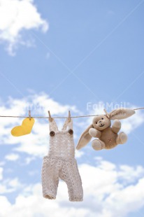 Fair Trade Photo Birth, Blue, Chachapoyas, Cloth, Clouds, Colour image, Hanging wire, Heart, New baby, Peg, Peluche, Peru, Sky, South America, Vertical, White, Yellow