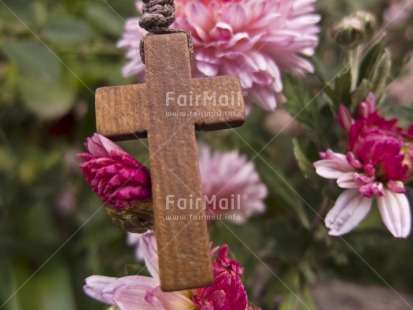 Fair Trade Photo Christianity, Colour image, Cross, Flower, Focus on foreground, Green, Horizontal, Nature, Outdoor, Peru, Pink, Religion, Religious object, South America, Spirituality, Tabletop