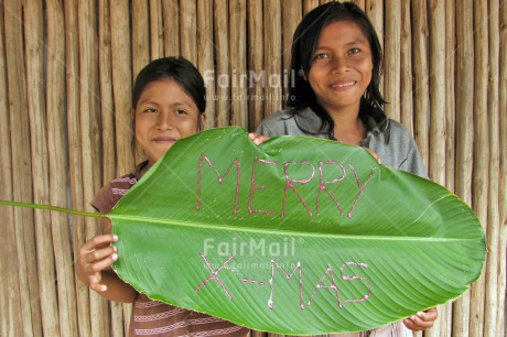 Fair Trade Photo Activity, Christmas, Colour image, Day, Green, Latin, Leaf, Letter, Looking at camera, Outdoor, People, Peru, Portrait halfbody, Smiling, South America, Two girls