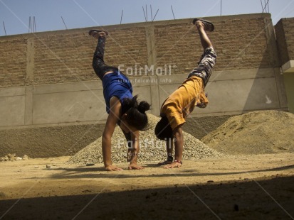 Fair Trade Photo 10-15 years, Activity, Casual clothing, Clothing, Colour image, Day, Horizontal, Latin, Low angle view, One boy, One girl, Outdoor, People, Peru, South America, Street, Streetlife, Yoga